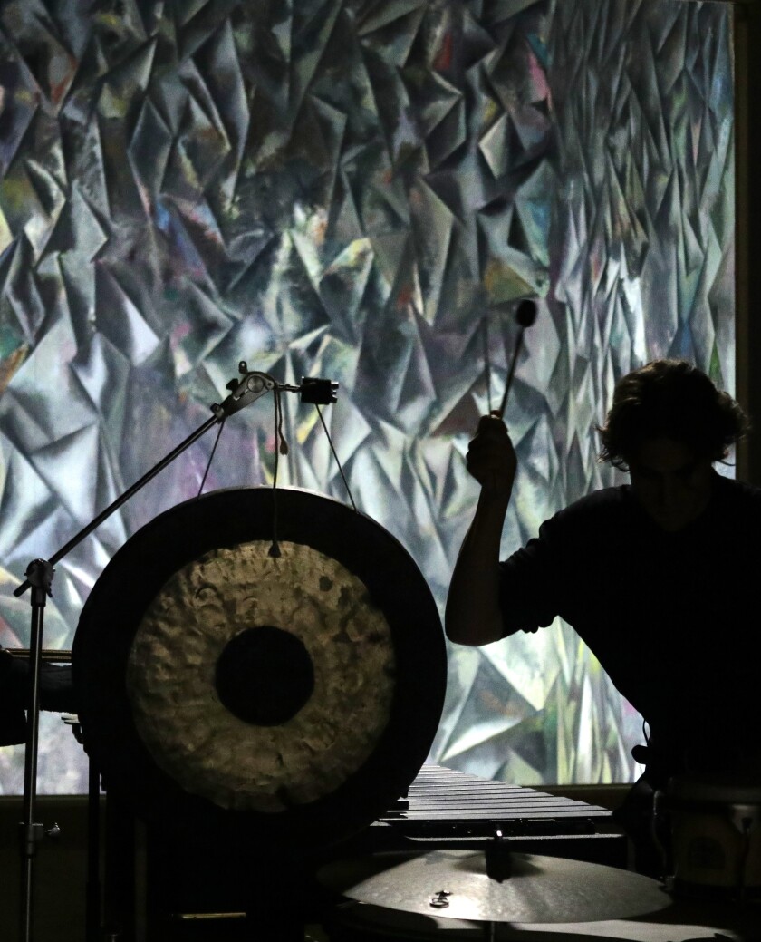 Jonathan Hepfer performs by a Guillermo Kuitca painting.