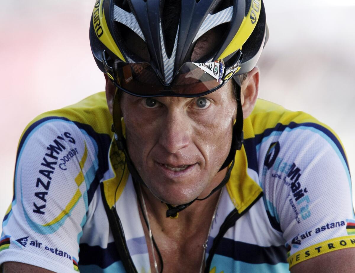 Lance Armstrong crosses the finish line during the 15th stage of the Tour de France in July 2009