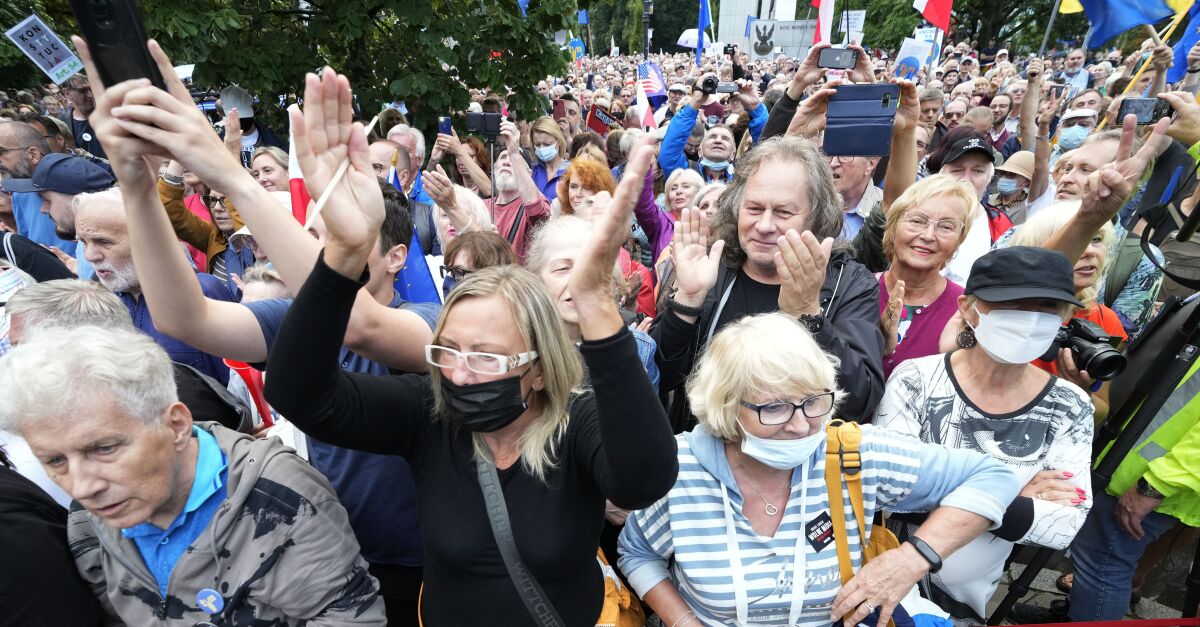 People demonstrate in defense of media freedom in Warsaw, Poland, on Tuesday, Aug. 10, 2021.