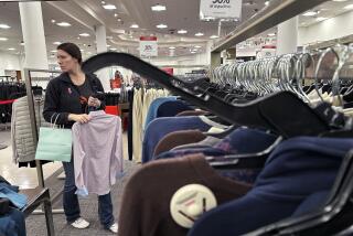 FILE - A woman shops at a retail store in Schaumburg, Ill., Dec. 18, 2023. On Friday, June 26, 2024, the Commerce Department issues its report on consumer spending for June. (AP Photo/Nam Y. Huh, File)