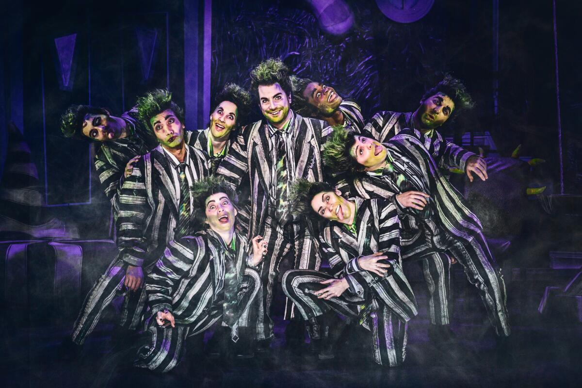 Justin Collette (center) and the touring company of "Beetlejuice," which arrives Aug. 15 in San Diego.