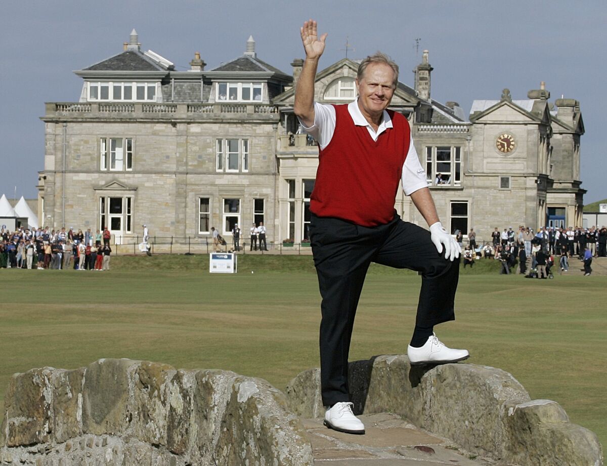FILE - Jack Nicklaus waves from the Swilcan Bridge during the final round of the British Open Golf Championship, on the Old Course at St. Andrews, Scotland, July 15, 2005. More than 500 years of legend and lore never gets old. It’s what led Jack Nicklaus to say so famously years ago, “When the British Open is in Scotland, there’s something special about it. And when it’s at St. Andrews, it’s even greater.”(AP Photo/Ted S. Warren, File)