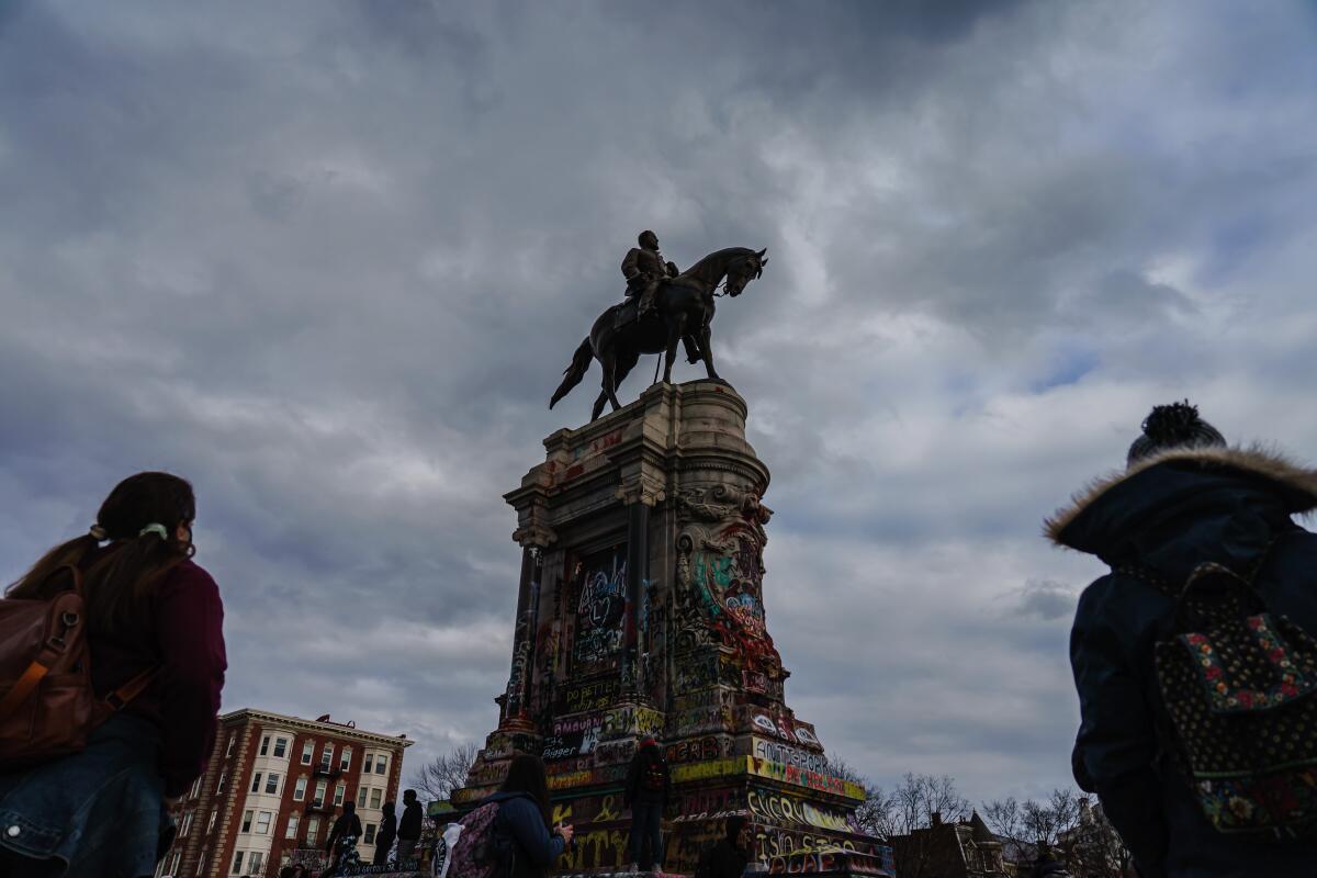  Robert E. Lee monument in Richmond, Va., defaced with graffiti