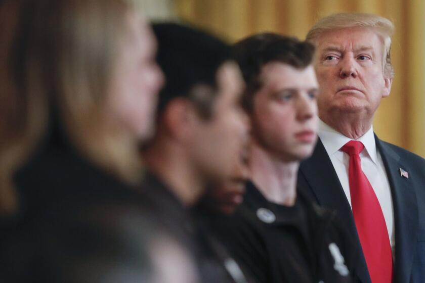 President Donald Trump looks over to members of Wounded Warrior Solider Ride during an event in the East Room of the White House, Thursday, April 18, 2019, in Washington. (AP Photo/Pablo Martinez Monsivais)