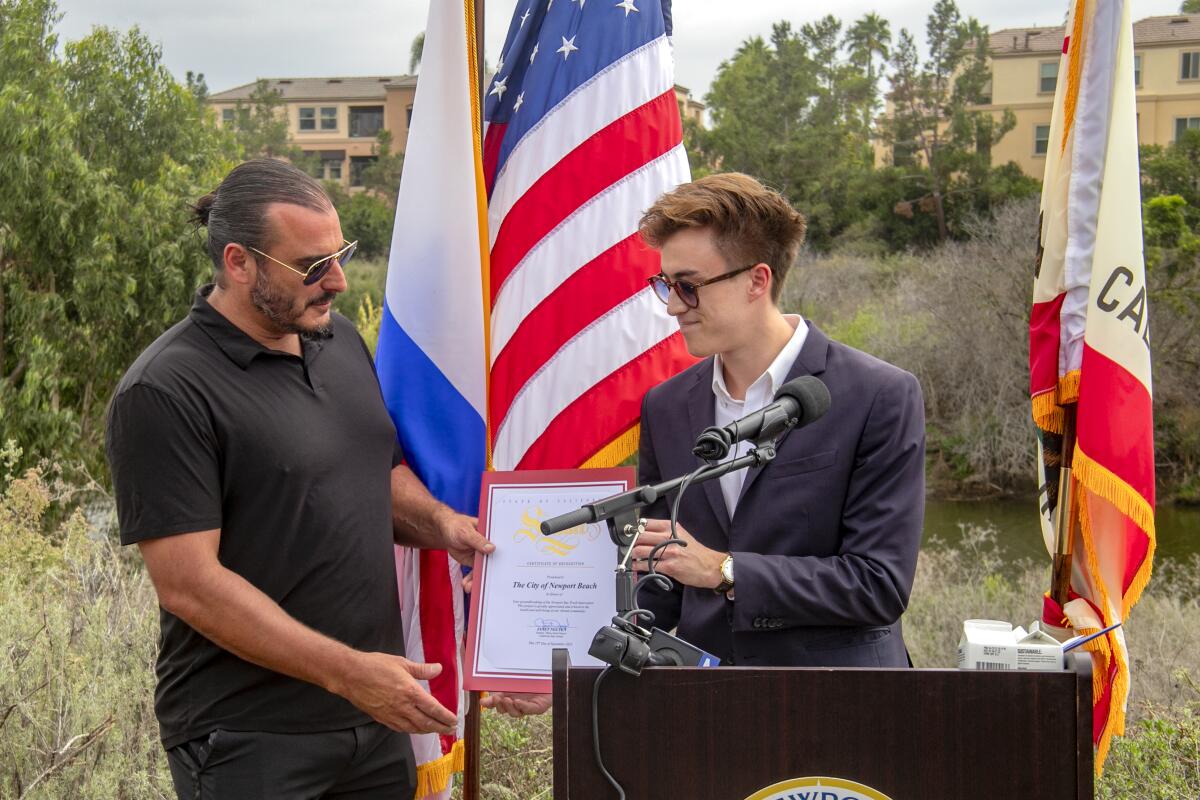 Newport Beach Mayor Noah Blom receives a Certificate of Recognition from the office of State Sen. Janet Nguyen.