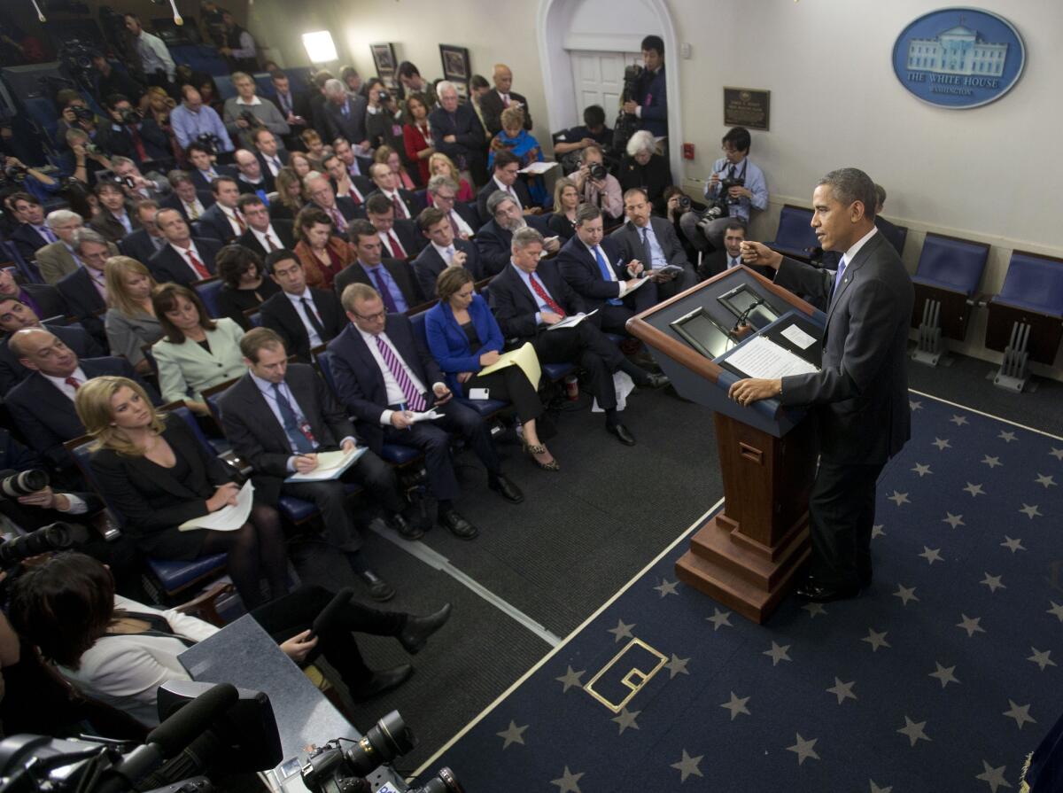 President Obama speaks to White House reporters during an end-of-the year news conference.