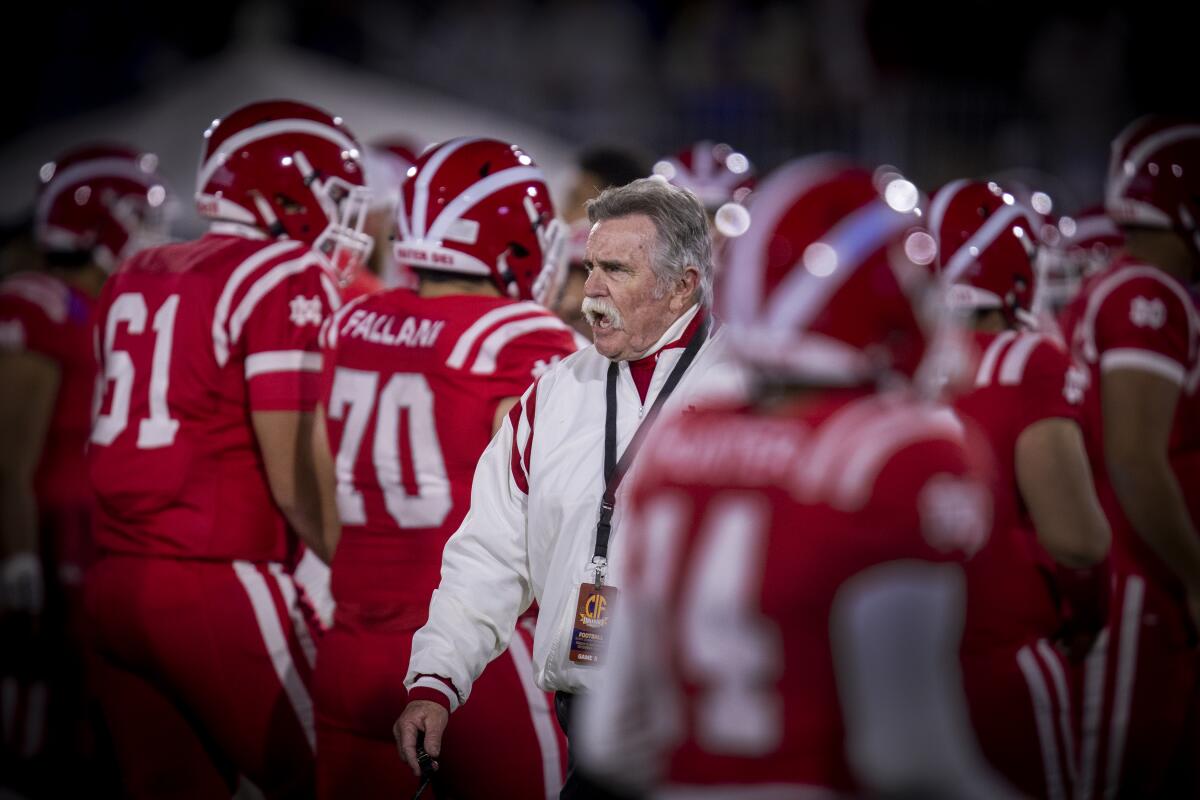 Mater Dei coach Bruce Rollinson with the football team.