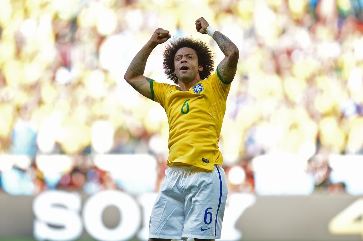 Brazil defender Marcelo celebrates after scoring in the penalty-kick shootout against Chile on Saturday. After playing Chile to a 1-1 draw, Brazil advanced on penalty kicks, 3-2.