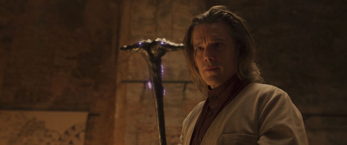 A man holding a cane