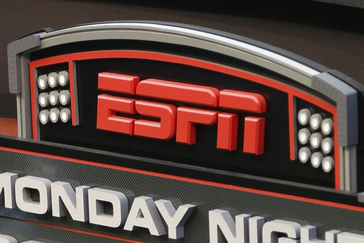 This Sept. 16, 2013 file photo shows the ESPN logo prior to an NFL football game between the Cincinnati Bengals and the Pittsburgh Steelers, in Cincinnati.