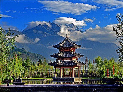 Extraordinary scenery helps to draw visitors to Lijiang in Yunnan province in southwestern China, and the Banyan Tree hotel just outside town seeks to add to the experience. Shown here is a view of Jade Dragon Snow Mountain -- actually a series of peaks -- from the Banyan Tree, one of the sophisticated new luxury hotels that have been springing up throughout China.