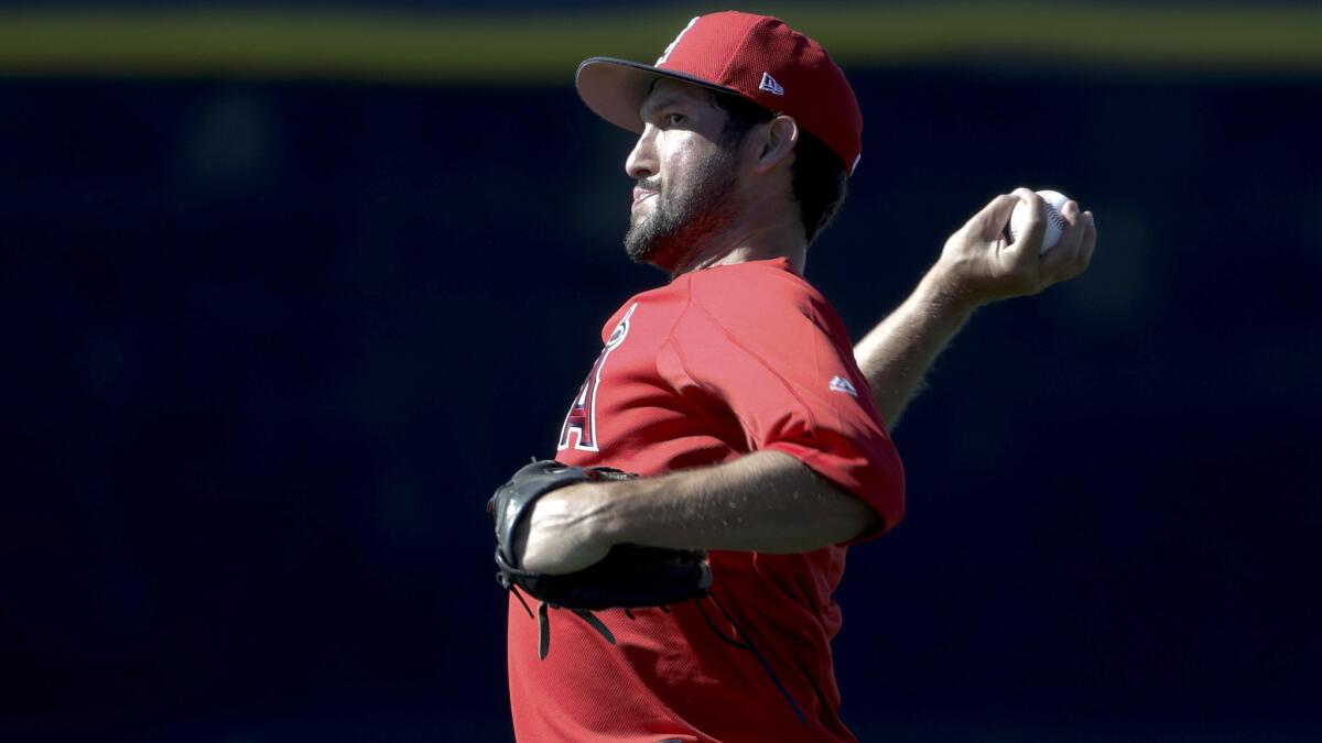 Angels relief pitcher Huston Street loosens up before a spring training workout last month in Tempe, Ariz.