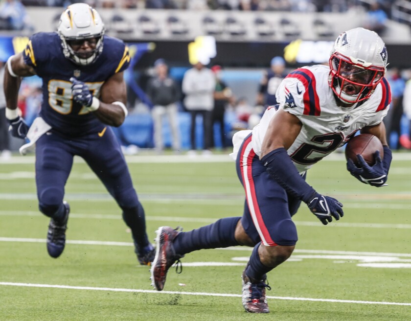 Patriots safety Adrian Phillips intercepts a pass and returns it for a touchdown in the fourth quarter Sunday.