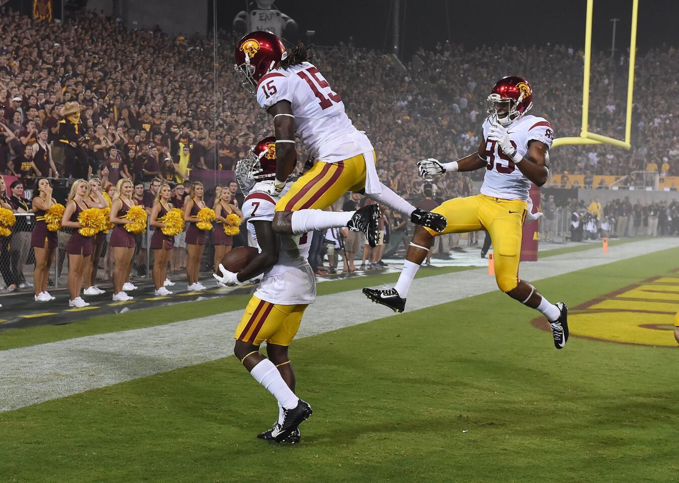 USC's Steven Mitchell Jr. (7) is joined in celebration by teammates Isaac Whitney (15) and De'Quan Hampton after his 27-yard touchdown reception in the second quarter Sept. 26 against Arizona State.