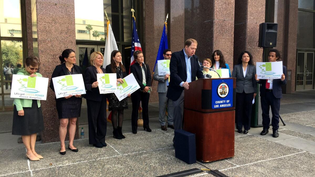 Mark Gold, associate vice chancellor for environment and sustainability at UCLA, speaks in favor of the new government-run utility during a news conference about the program in April.