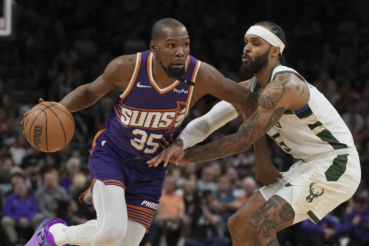 Phoenix Suns forward Kevin Durant drives to the basket during a game against the Milwaukee Bucks