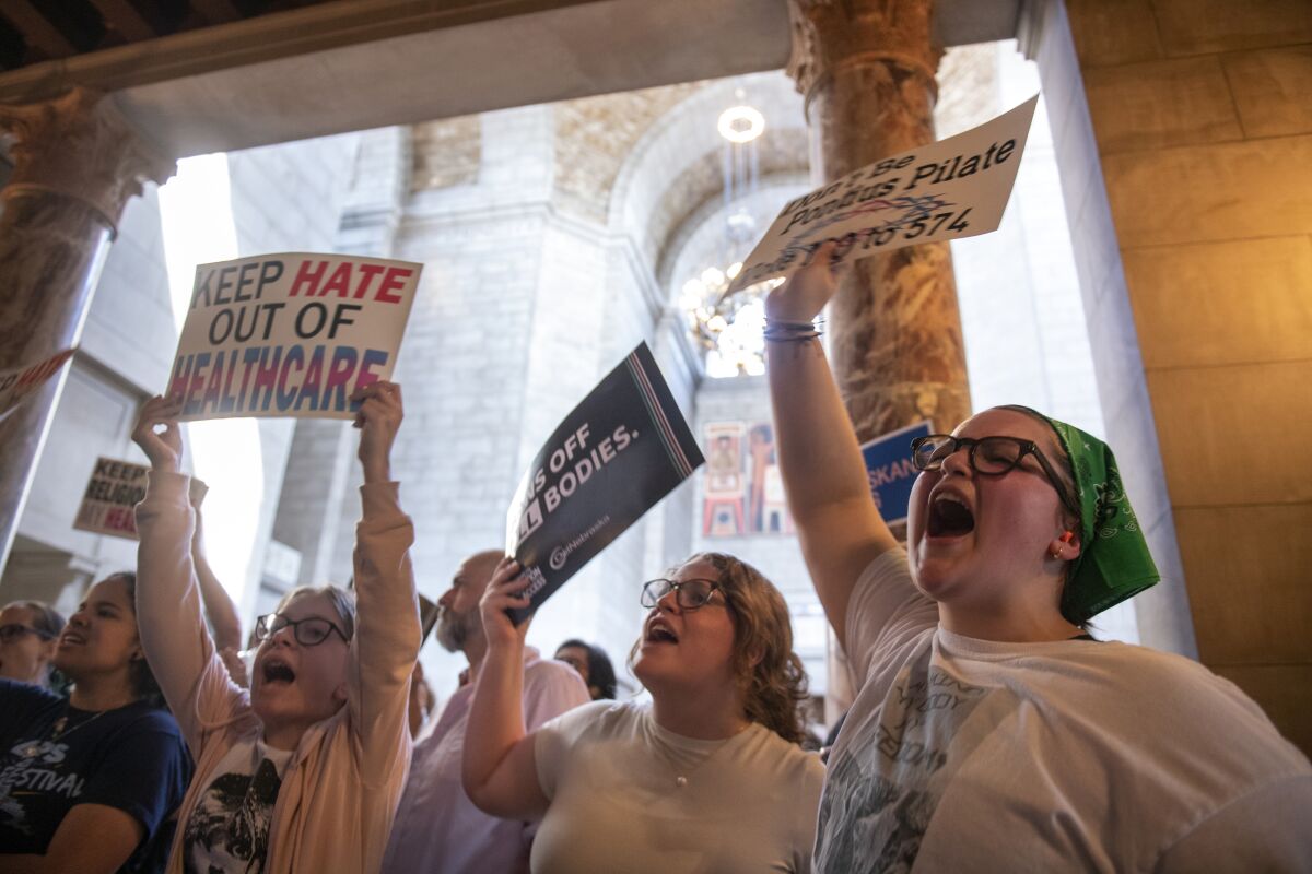 Protestors of LB 574, which limits gender-affirming care for trans youth, gather outside the legislative chamber, Friday, May 19, 2023, in Lincoln, Neb. (Justin Wan/Lincoln Journal Star via AP)