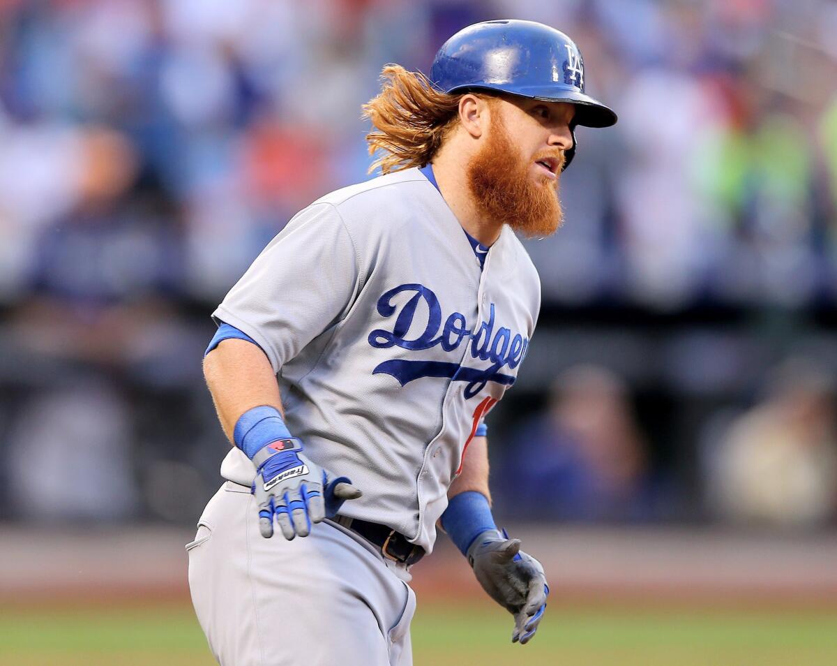 Dodgers third baseman Justin Turner rounds the bases after hitting a solo home run against the Mets on July 24.