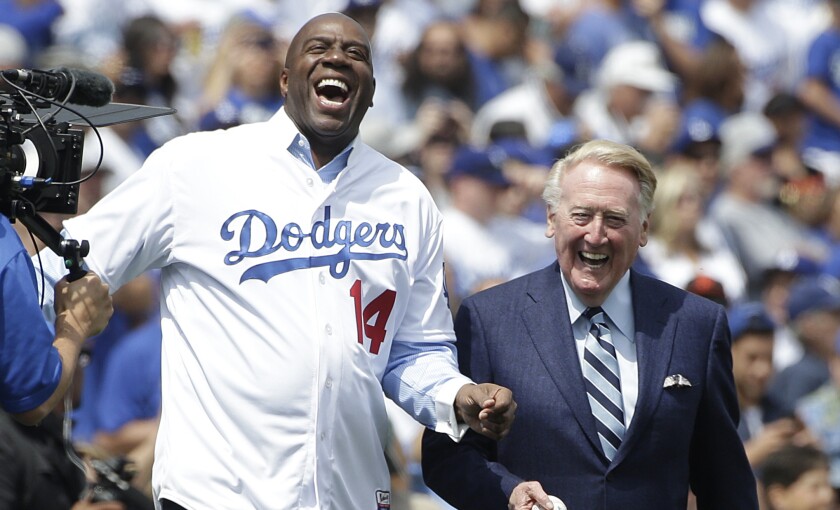 Magic Johnson, left, and Vin Scully are the two finalists in the Los Angeles Times’ month-long tournament to determine “The Biggest Icon In L.A. Sports History”