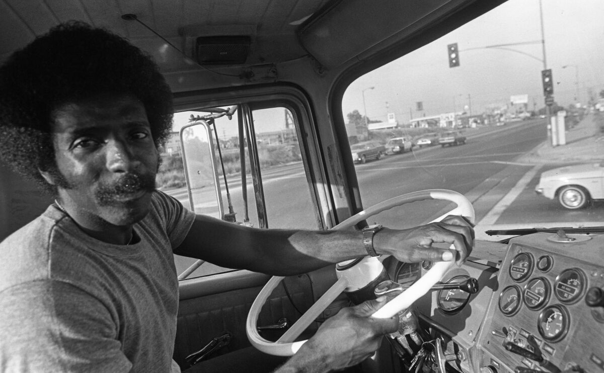 Allen Hollis driving for his family's trucking firm.
