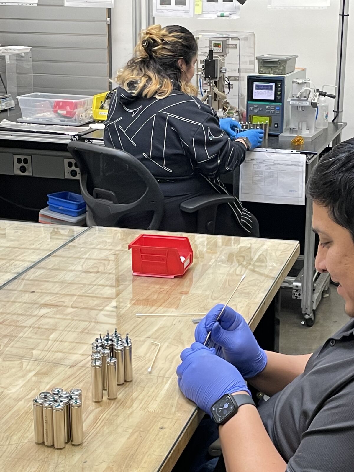 American Lithium technician and lab manager work on advanced R&D batteries for Department of Defense customers