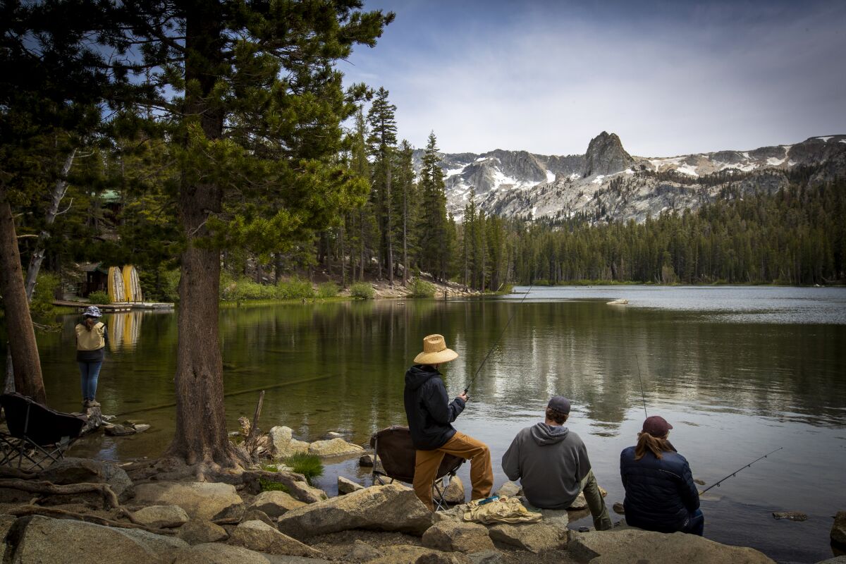 Visitors fish at Lake Mamie.