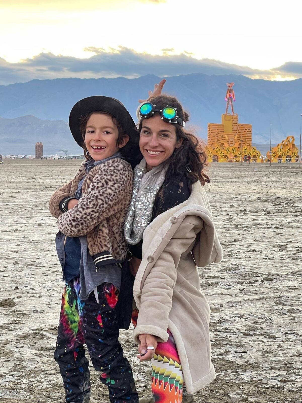 Bianca Snyder poses with her 7-year-old son Tage at Burning Man.
