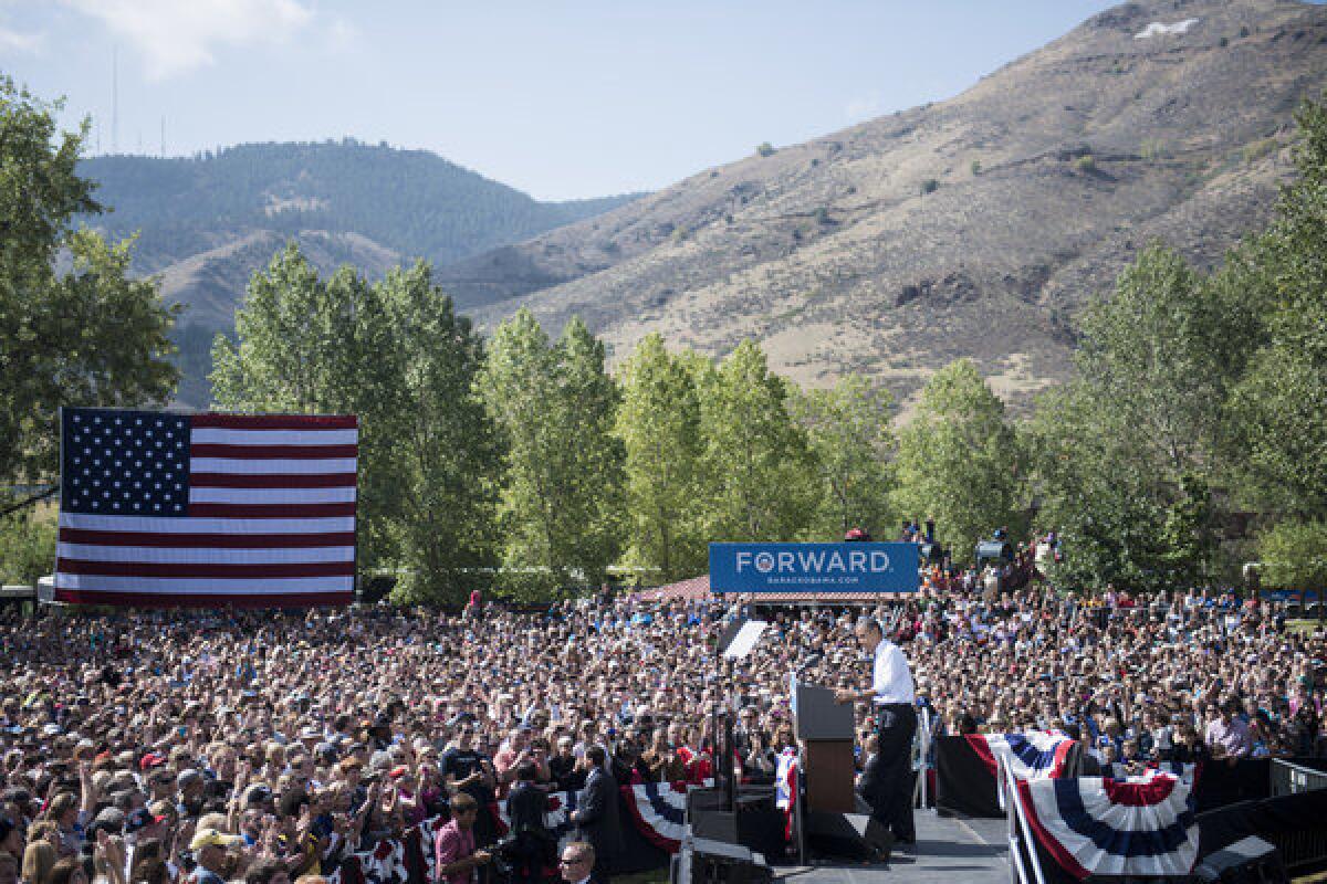 President Obama pauses while speaking during a campaign event in Lions Park in Golden, Colo.