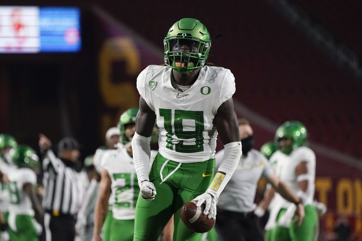Oregon safety Jamal Hill celebrates after a play during the first quarter against USC on Dec 18, 2020.