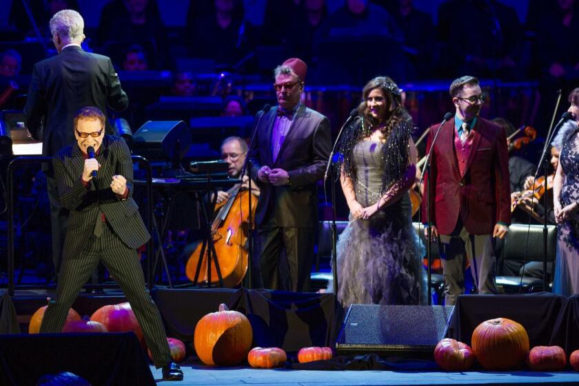 LOS ANGELES, CA - OCTOBER 31, 2015: Danny Elfman sings with the chorus during the "Nightmare Before Christmas" concert at the Hollywood Bowl. (Michael Baker / For The Times)