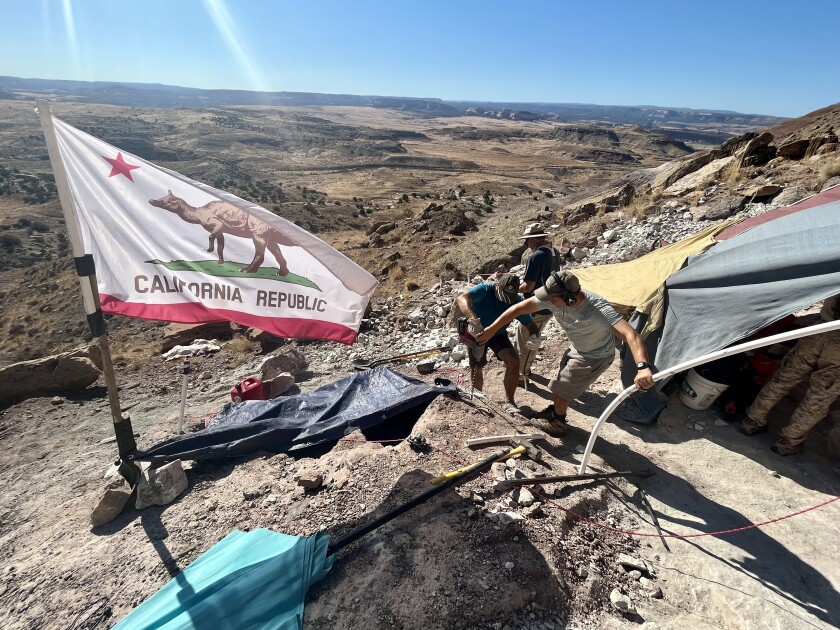 A paleontology crew prepares power tools for a stegosaurus fossil excavation near Bitter Creek, Utah.