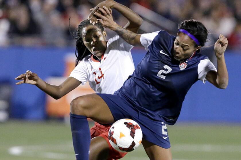 U.S. forward Sydney Leroux (2) and Canada defender Kadeisha Buchanan (14) vie for the ball during the first half of a soccer game on Friday in Frisco, Texas.