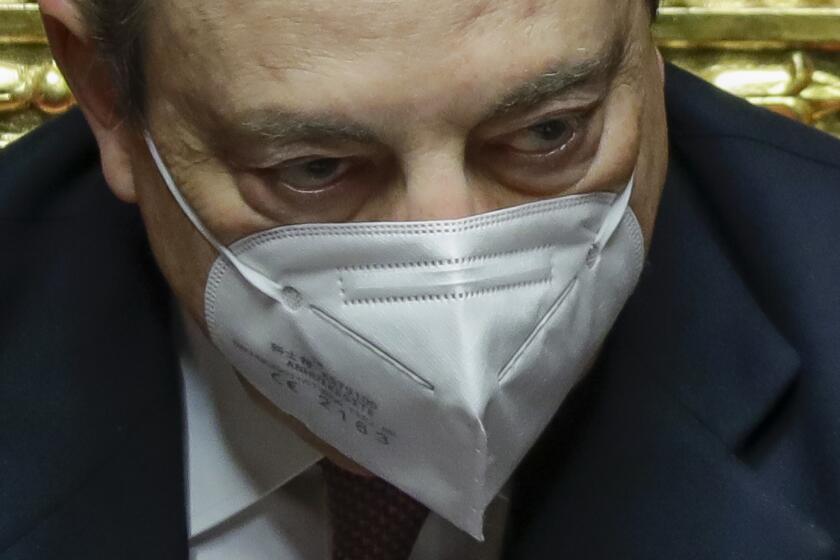 Italy's Prime Minister Mario Draghi attends a debate at the Senate, in Rome, Wednesday, Feb. 17, 2021, before submitting his government to a vote of confidence. (AP Photo/Andrew Medichini, Pool)