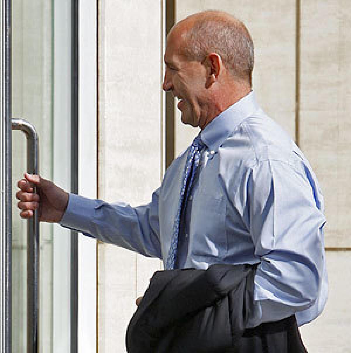 Former Orange County Sheriff Mike Carona arrives at the federal courthouse in Santa Ana for jury selection in his corruption trial.