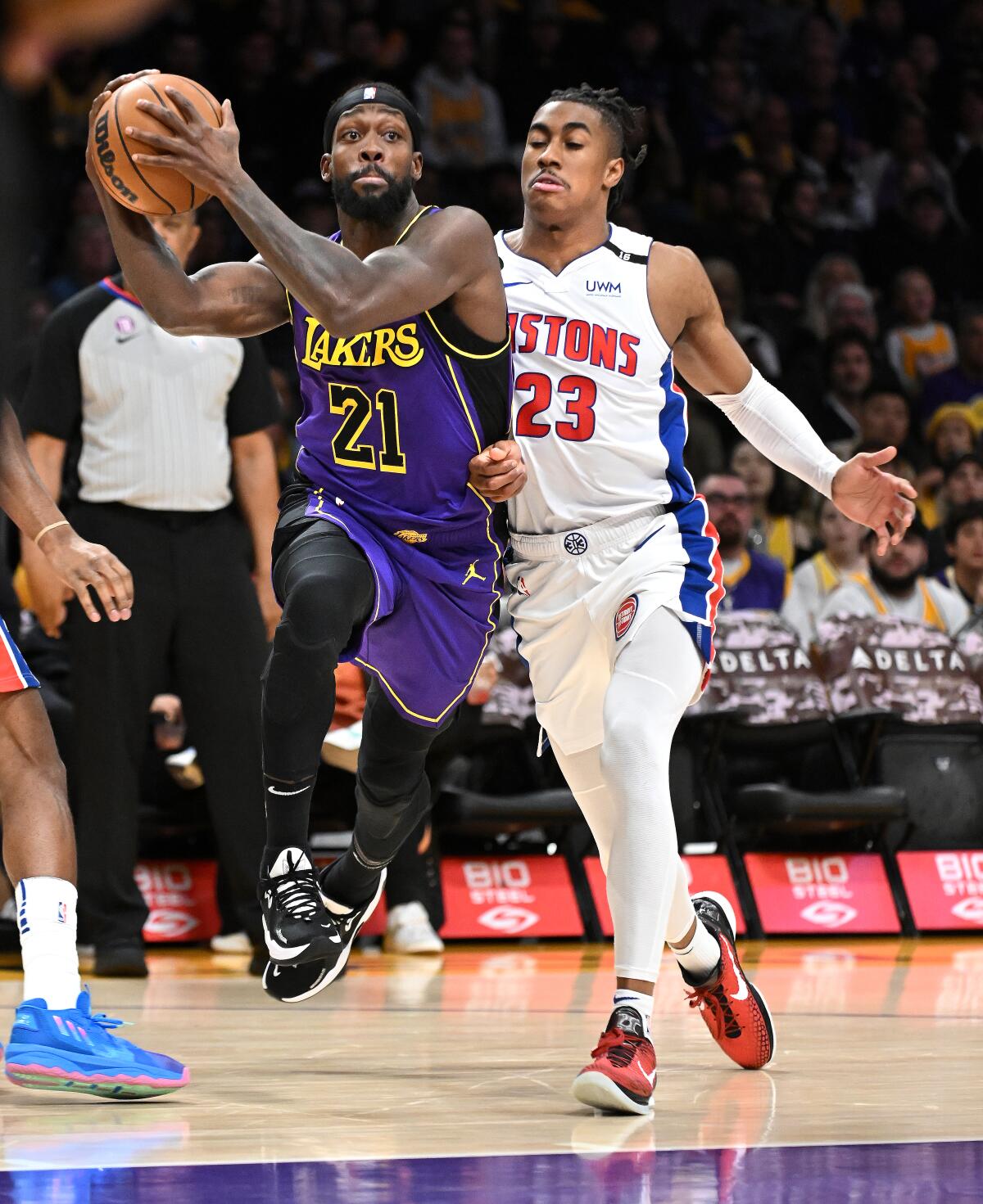 Lakers guard Patrick Beverley, left, drives past Detroit Pistons guard Jaden Ivey in the first quarter Friday.
