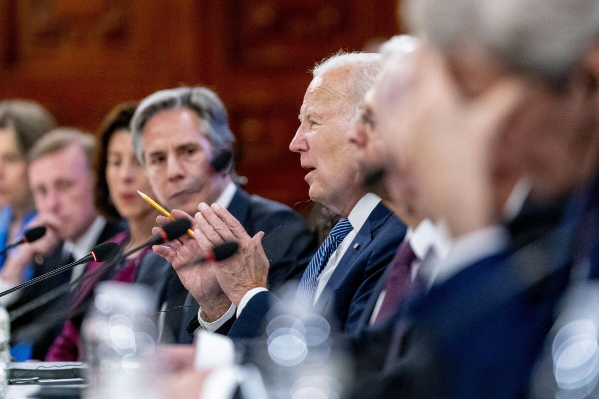 President Biden, accompanied by Secretary of State Antony Blinken, speaks during a meeting with Mexico's president.
