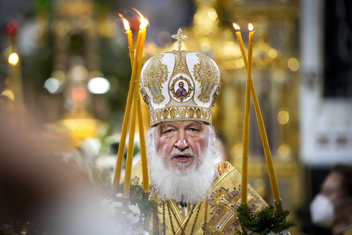 Russian Orthodox Patriarch Kirill delivers the Christmas Mass in the Christ the Saviour Cathedral in Moscow, Russia, Thursday, Jan. 6, 2022. Parishioners wearing face masks to protect against coronavirus, observed social distancing guidelines as they attended the the Mass. Orthodox Christians celebrate Christmas on Jan. 7, in accordance with the Julian calendar. (AP Photo/Alexander Zemlianichenko)