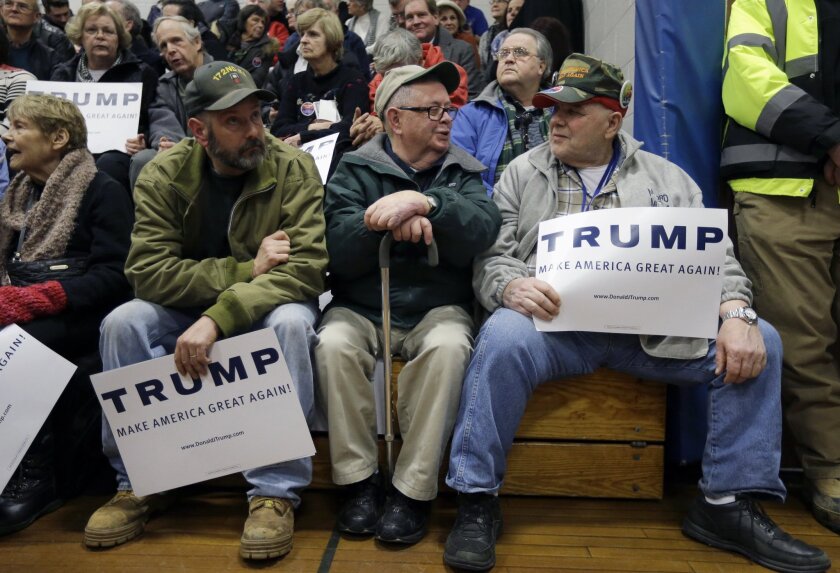Supporters of Republican presidential candidate Donald Trump talk while waiting for the start of a Trump campaign event on Dec. 28 in Nashua, N.H.