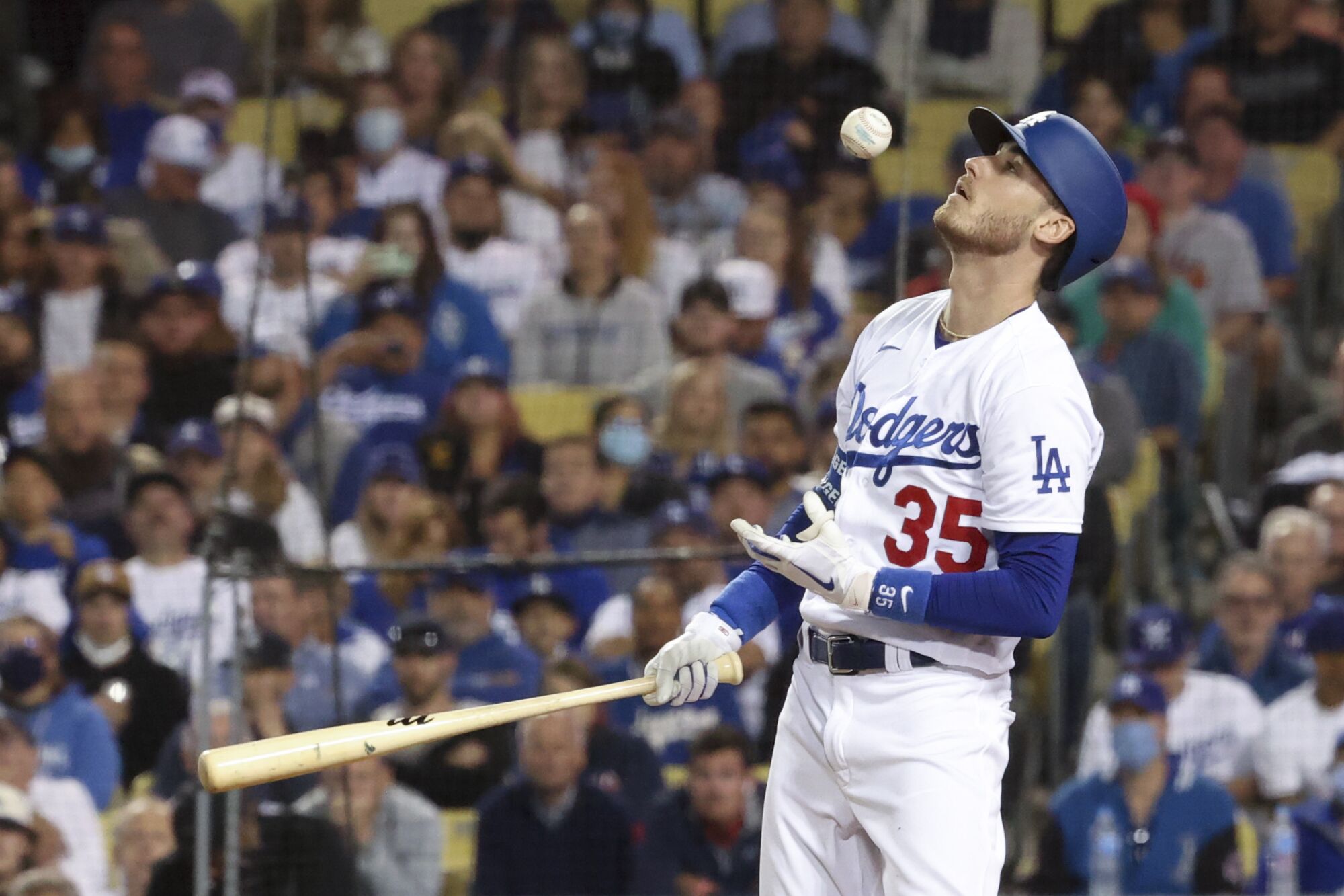 Dodgers' Cody Bellinger catches his foul ball.