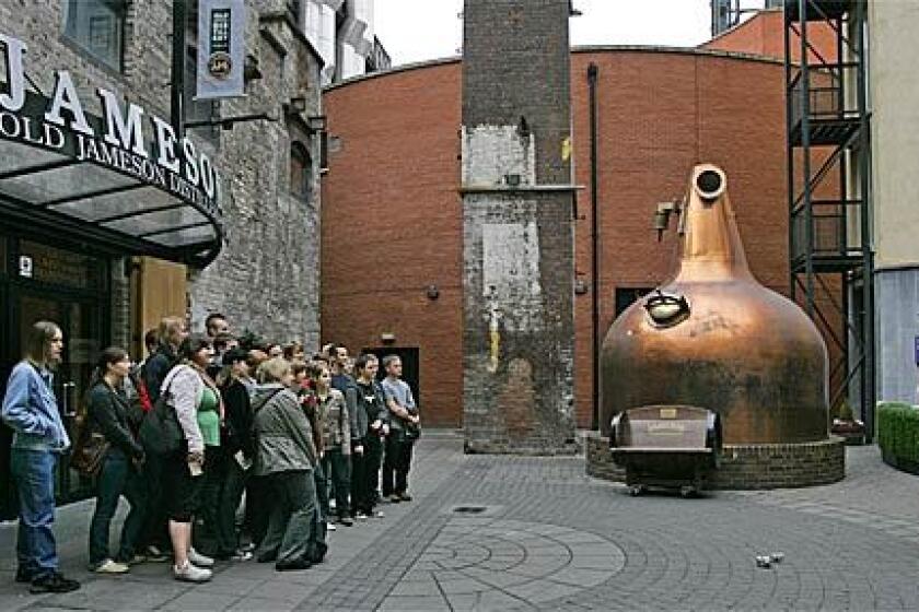 A writer's recent do-it-yourself tour covered four whiskey tasting centers in Ireland. Last on the list was the Old Jameson Distillery, built in 1780 in Dublin. Visitors interested in seeing the Jameson operation can tour facilities in Dublin or Midleton, Ireland. Here, a group of visitors poses in front of the entrance to the Dublin facility.