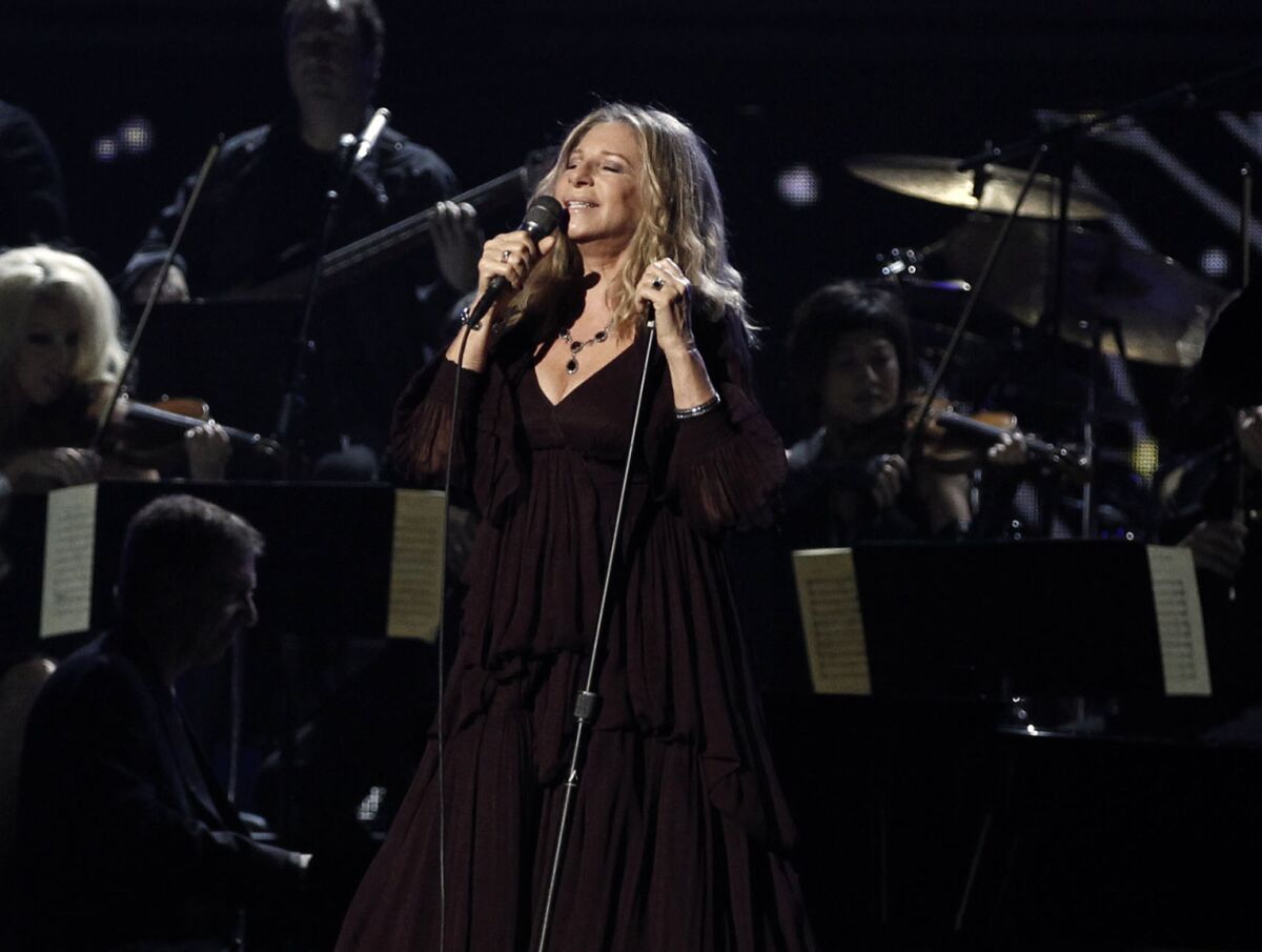 FILE - Barbara Streisand performs at the 53rd annual Grammy Awards in Los Angeles on Feb. 13, 2011. The Grammy Museum is launching its own online streaming service featuring performances and interviews from A-list musicians, as well as material from the museum’s archive. About 40 programs will be available at the launch, including performances and interviews from Streisand, Billie EIllish and her producer-brother FINNEAS, Selena Gomez, Herb Alpert and Jerry Moss. (AP Photo/Matt Sayles, File)