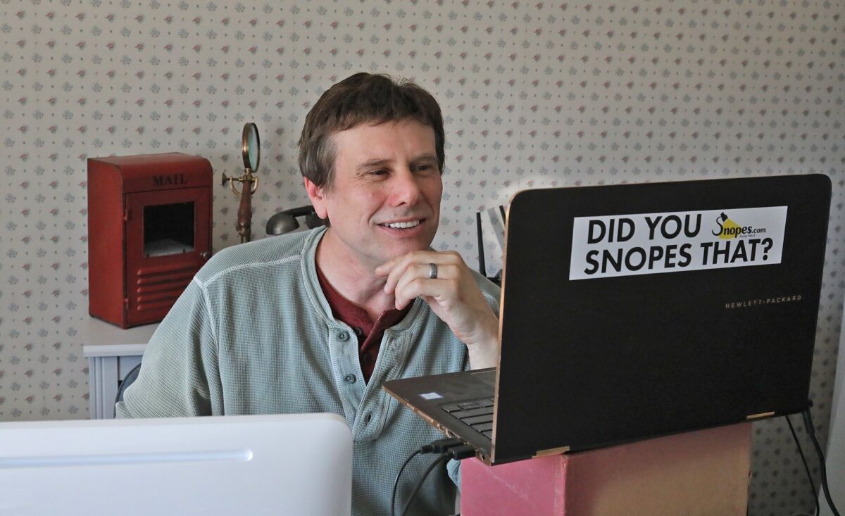 FILE - This Sept. 25, 2018 file photo shows David Mikkelson, founder of Snopes, the site that tracks fakery on the web, in his home office in Tacoma, Wash. The co-founder, CEO and a major shareholder of the fact-checking site admitted to plagiarizing from dozens of articles done by mainstream news outlets over several years, calling the appropriations “serious lapses in judgment.” From 2015 to 2019, and possibly even earlier, Mikkelson included material lifted from the Los Angeles Times, The Guardian and others to scoop up web traffic, according to BuzzFeed News, which broke the story Friday, Aug. 13, 2021. (Greg Gilbert/The Seattle Times via AP, File)