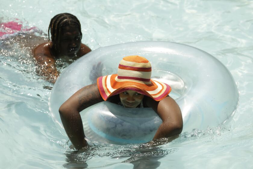 PALMDALE, CA - JULY 11, 2021 - - People cool off at Dry Town Water Park where temperatures reached 108 degrees by 3 p.m. in Palmdale on Sunday on July 11, 2021. (Genaro Molina / Los Angeles Times)