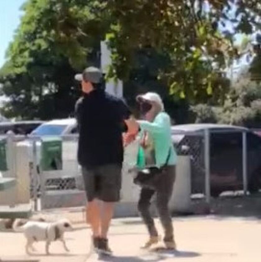 A still image from video shows a man apparently being pepper-sprayed at Dusty Rhodes Park in Ocean Beach.