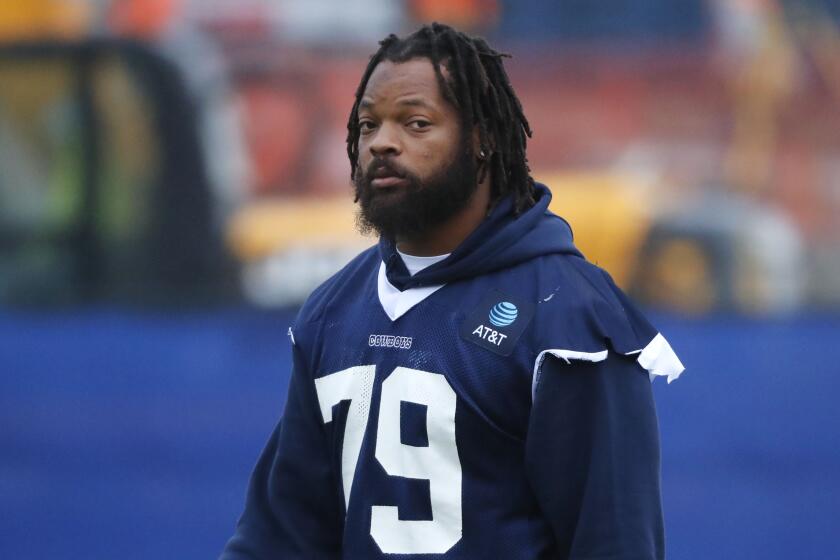 Dallas Cowboys defensive lineman Michael Bennett (79) walks onto the field.