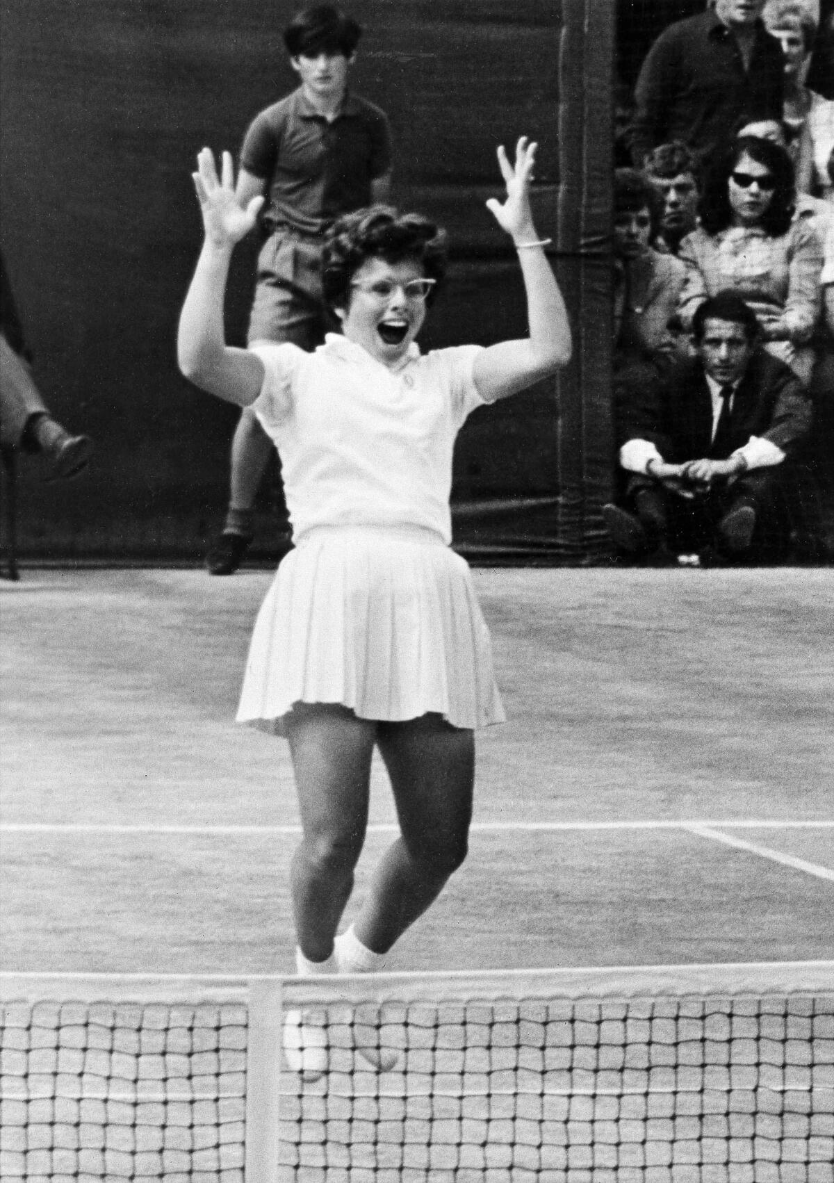 Billie Jean King leaps for joy after her winning shot to clinch the Wimbledon singles title in London, July 2, 1966.