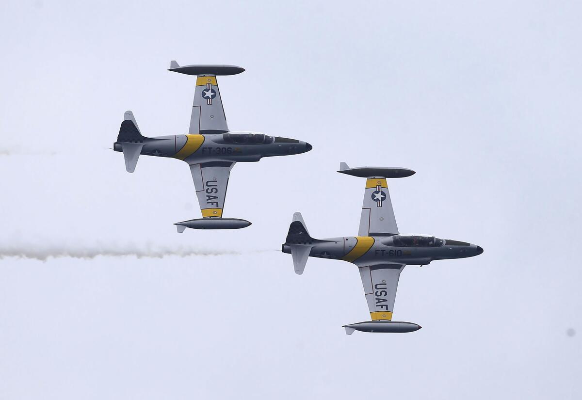 Pilots Greg "Wired" Colyer and Rob "Scratch" Mitchell fly their historic T-33 Ace Makers.