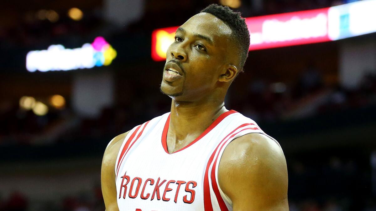 Houston Rockets forward Dwight Howard reacts during the team's blowout loss to the Golden State Warriors in Game 3 of the Western Conference finals on Saturday.