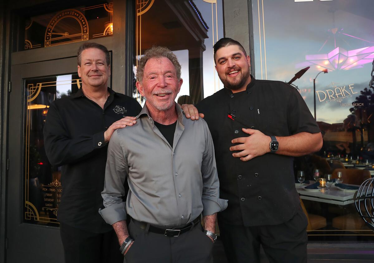 Alec Glasser stands with Matthew Timmes and sous chef Nick Gstrein.