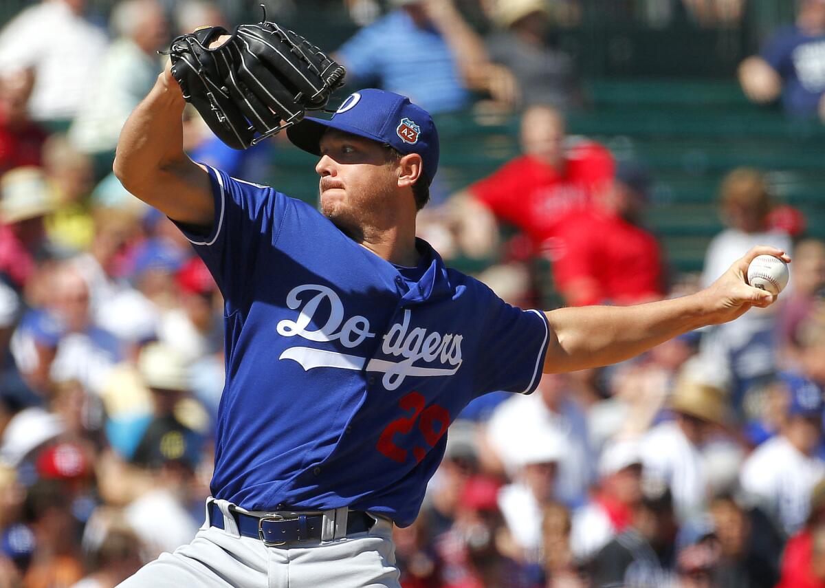 Dodgers pitcher Scott Kazmir throws against the Angels during a spring training game on Wednesday.